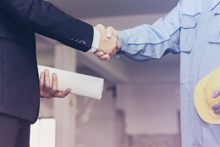 architect engineer shaking hands with businessman site 1357 331